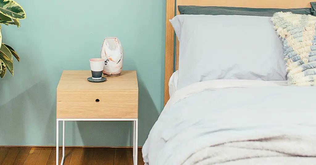 Nightstand with storage at the same height as the bed