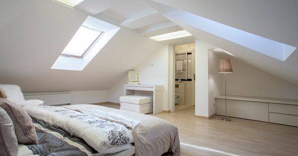Bedroom in attic with slanted walls